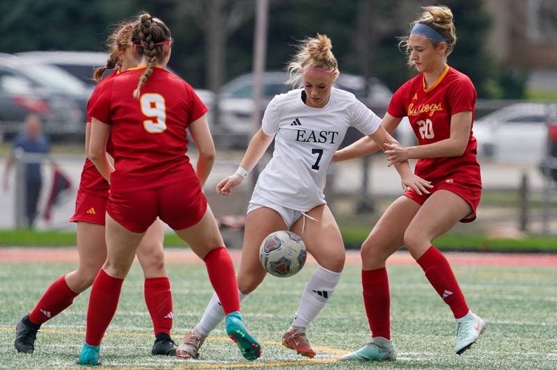 Batavia’s Riley Bainter (20) defends against Oswego East's Gabby McPhee (7) in the midfield during a soccer match at Batavia High School on Saturday, March 29, 2025.