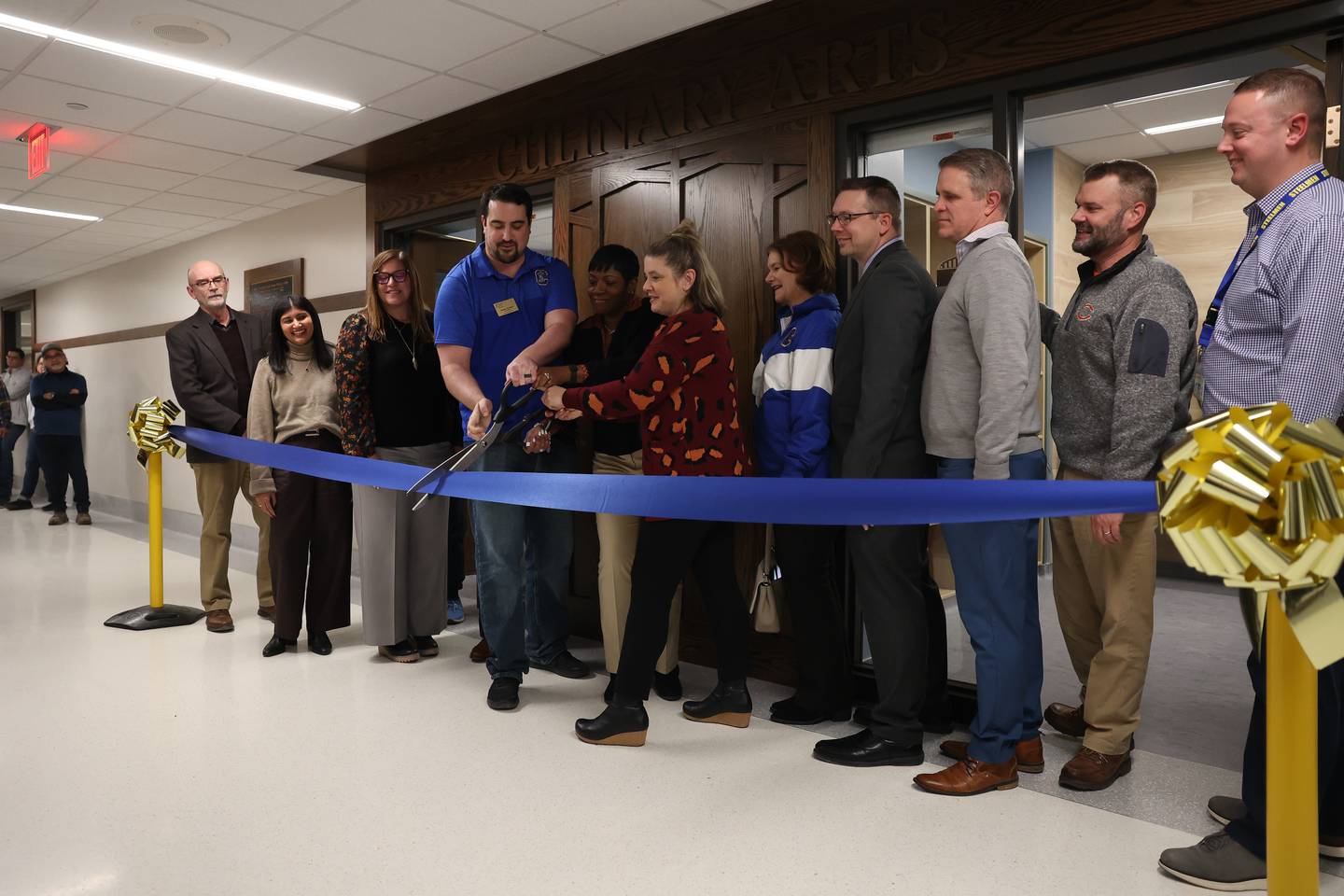 Joliet District 204 board members and Joliet Central staff cut the ribbon at the ribbon cutting ceremony for Joliet Central’s new culinary arts addition on Monday, Jan. 6, 2025 in Joliet.