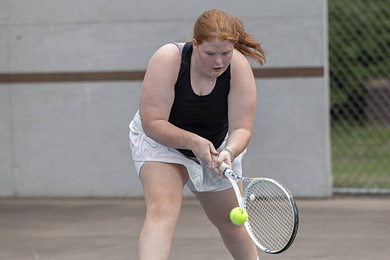 Julia Rhodes returns a shot during a doubles match Thursday, July 27, 2023 at the Emma Hubbs Tennis Classi