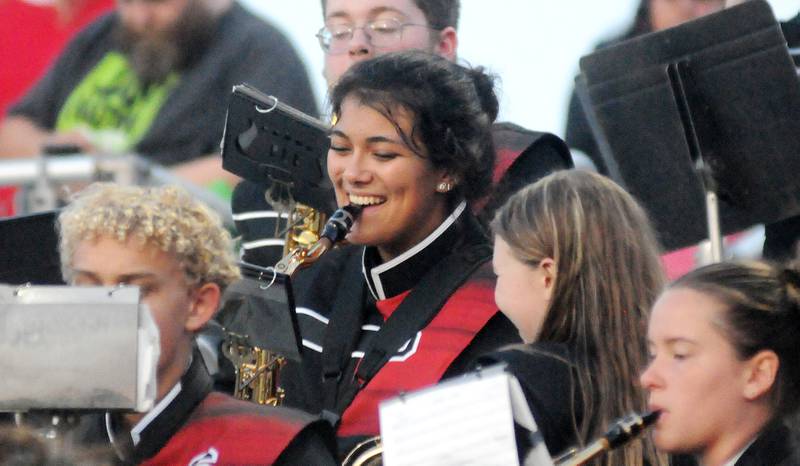Members of the Streator marching band share a laugh while performing in the stands on Friday, Aug. 29, 2025 at Doug Dieken Stadium in Streator.
