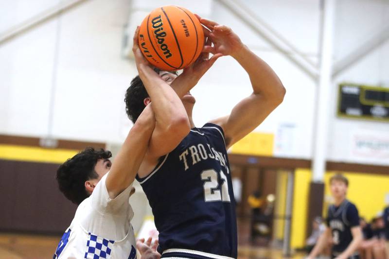Cary-Grove’s Adam Bauer, right, is fouled by Larkin’s Aden Mora in varsity boys basketball Hinkle Holiday Classic action on Friday, Dec. 26, 2025, at Jacobs High School in Algonquin.