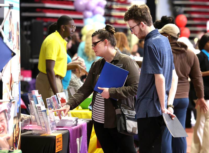 Vistors check out some of the information at the booths Thursday, April 24, 2025, during the Local Showcase and Spring Show in the Convocation Center at Northern Illinois University in DeKalb.