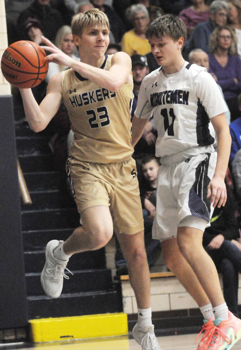 Serena's Tanner Faivre passes as Lexington's Griffin Hari defends in the Marquette Christmas Tournament championship game on Friday, Dec. 28, 2023.