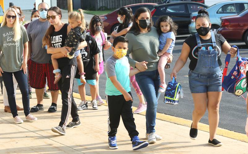 Parents and students arrive for the first day of school Wednesday, Aug. 18, 2021, at Founders Elementary School in DeKalb. Students returned to classes for the new year Wednesday in the DeKalb and Sycamore school districts.