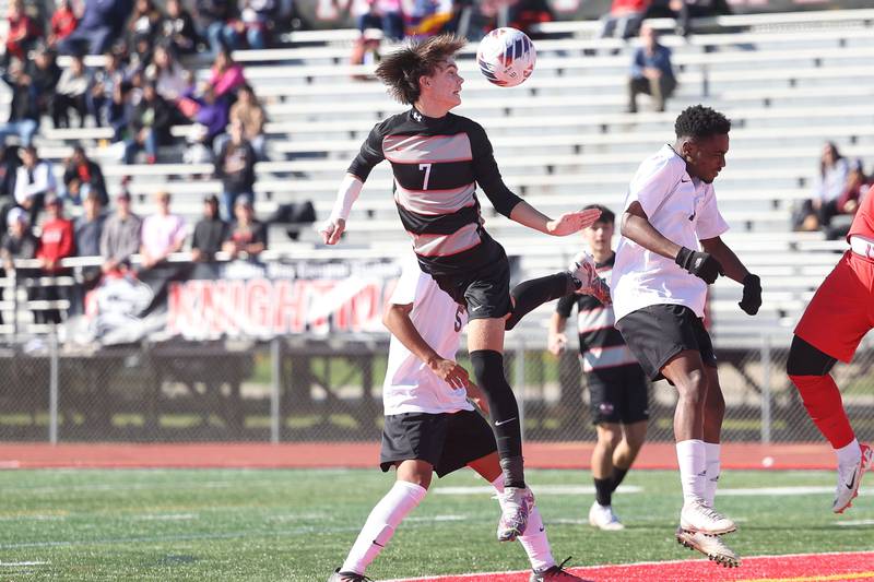 Lincoln-Way Central’s Connor Pate heads a shot against TF North in the Class 3A regional championship on Saturday, Oct. 21 in New Lenox.