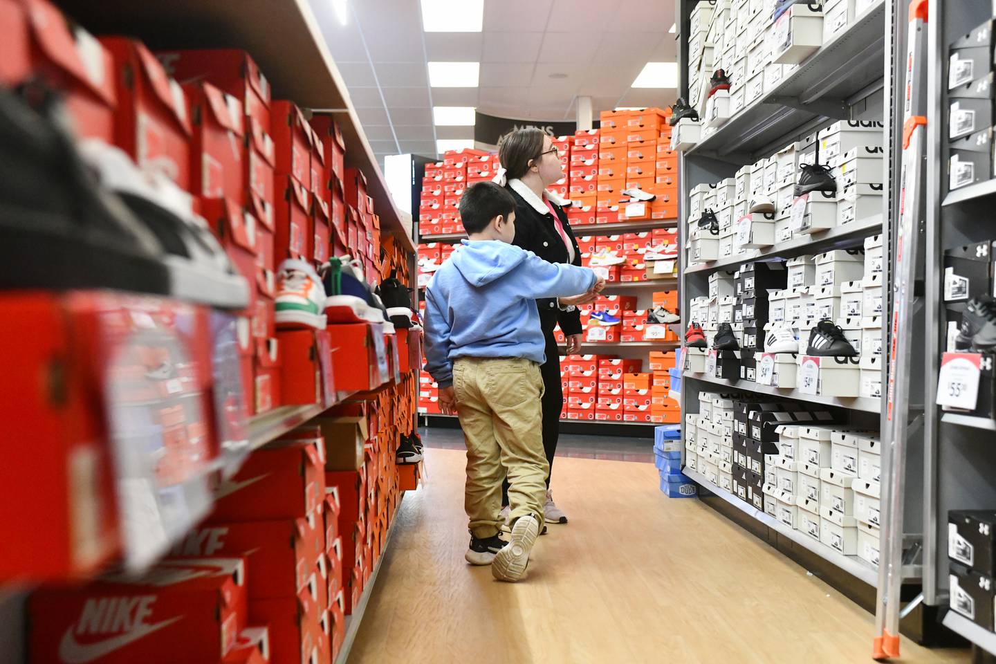 A Steuben Elementary student chooses a new pair of shoes at Shoe Carnival with help from Kankakee School District paraprofessional Julissa Avalos as part of the Kankakee Kiwanis Club's annual “All God’s Children Must Have Shoes” event on Feb. 27, 2025.
