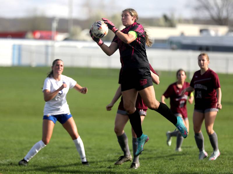 Marengo’s Macy Noe grabs a the ball out of the air during a Kishwaukee River Conference soccer match against Johnsburg on Wednesday, April 15, 2026, at Marengo High School.