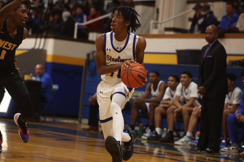 Joliet Central’s Jonah Nichols looks for a play against Joliet West.