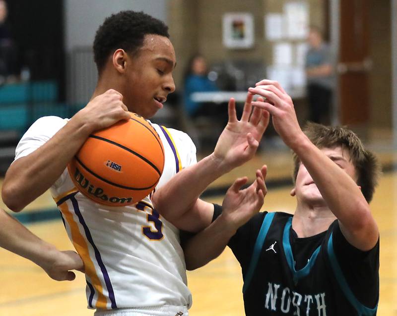 Hononegah's Caleb Hart steals th ball from Woodstock North's Curtis Czeslawski during the 2025 Hoops for Healing tournament basketball game on Wednesday, Nov. 26, 2025, at Woodstock North High School.