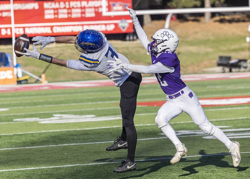 Maroa-Forsyth's Cayden Birmingham reaches but can’t haul in a pass against Wilmington's Ryan Kettman Friday, Nov. 28, 2025, in the Class 2A football finals at Hancock Stadium at ISU.