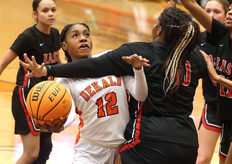 DeKalb's Brytasia Long is fouled by Rockford East's Makya Knox during their game Wednesday, Jan. 22, 2025, at DeKalb High School.