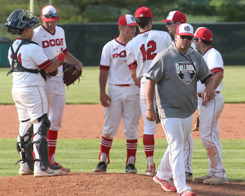 Streator baseball coach Brennon Martin walks off the mound before talking to his team during the Class 3A Sectional semifinal game on Wednesday, May 31, 2023 at Metamora High School.