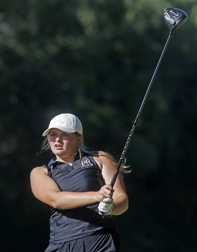 Prairie Ridge’s Grace Mertel watches her tee shot on the 5th hole during the Fox Valley Conference Girls Golf Tournament Wednesday, Sept. 25, 2024, at Crystal Woods Golf Club in Woodstock.