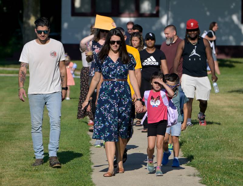 Students and parents arrive at Louise White Elementary School in Batavia for the first day of classes on Wednesday, Aug 14, 2025.