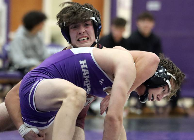 Hampshire’s David Becker, bottom, battles Prairie Ridge’s Mikey Meade at 132 pounds in varsity wrestling on Thursday, Dec. 5, 2024 at Hampshire High School in Hampshire.