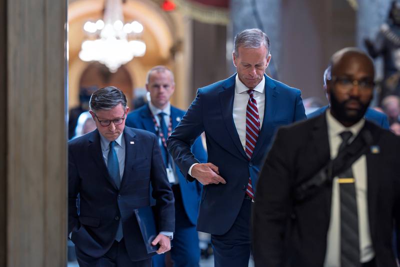 Speaker of the House Mike Johnson, R-La., left, and Senate Majority Leader John Thune, R-S.D., return to their offices after speaking with reporters on the third day of the government shutdown, at the Capitol in Washington, Friday, Oct. 3, 2025. (AP Photo/J. Scott Applewhite)