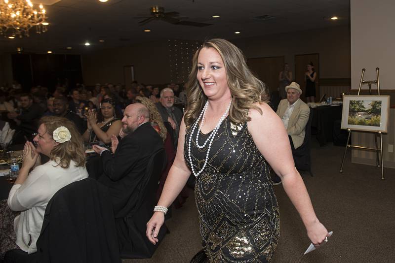 Emily Zimmerman heads for the stage after being named one of the 4 under 40 award winners Friday, May 6, 2022 at the Best of Dixon awards.