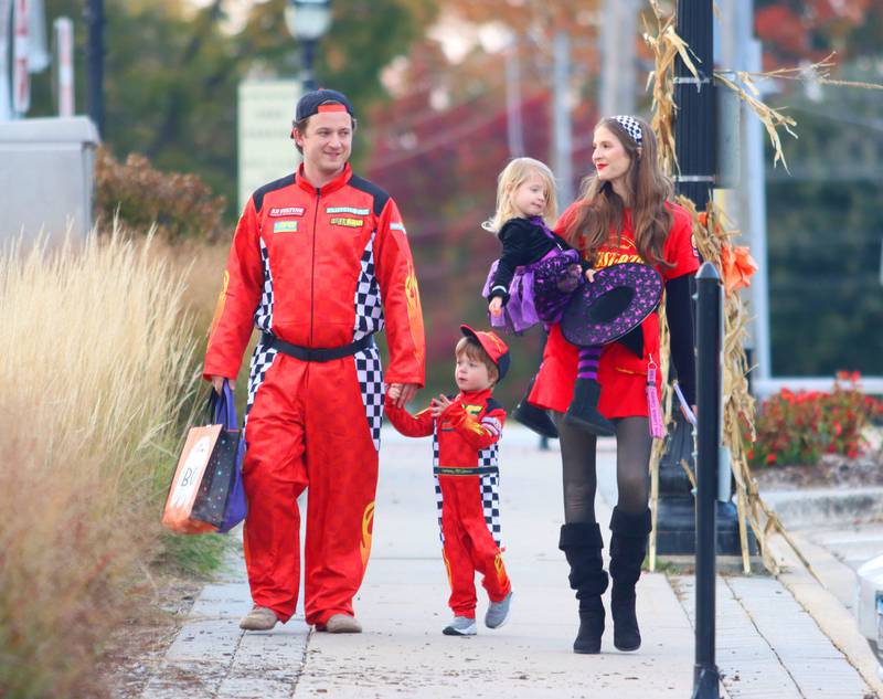 Jake Dushane and Mikayla Lyp of Crystal Lake trick-or-treat with their children Elijah and Layla in downtown Crystal Lake on Friday, October. 31, 2025