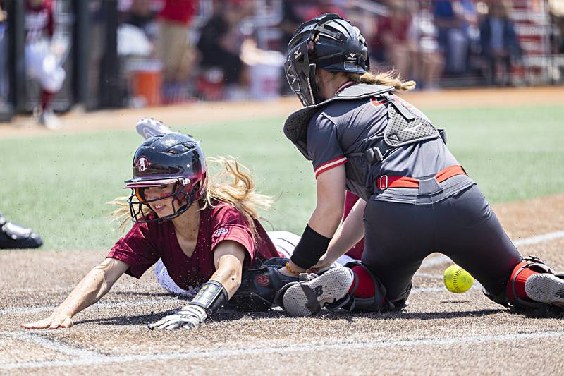 Antioch’s Miranda Gomez slides in safely at home to score the first run for her team against Charleston Friday, June 9, 2023 in the class 3A state softball semifinal.