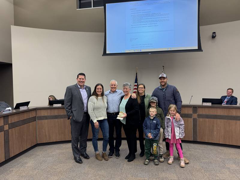 Retiring Morris Deputy City Clerk Gail Hussey with her family and Morris Mayor Chris Brown (left) during the Monday, Jan. 12 Morris City Council meeting.