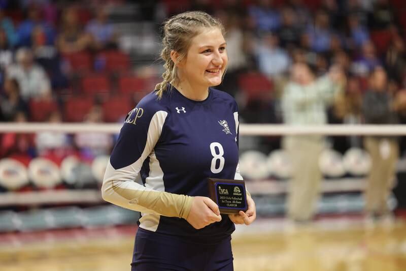 IC Catholic’s Lucy Russ receives a plaque for Class 2A Girls Volleyball 1st Team All-State before the Knights match against Mater Dei in the Class 2A Volleyball Championship match on Saturday, Nov. 11, 2023 in Normal.