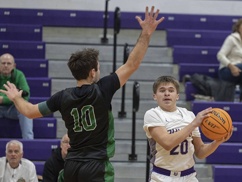 Dixon’s Cameron Foulker looks to make a play while being defended by Alleman’s Jack Wendt Wednesday, Jan. 28, 2026.