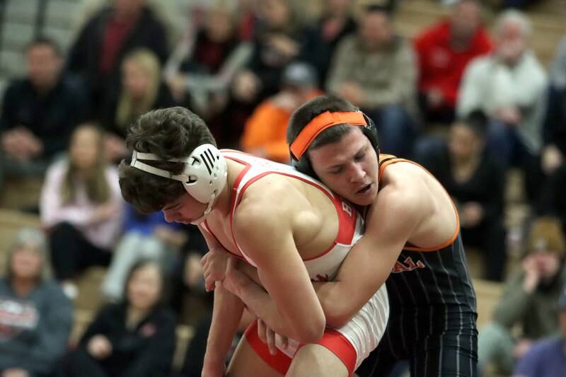 Huntley’s Gavin Nischke, left, battles Crystal Lake Central’s Brandon Carbone at 138 pounds in varsity wrestling on Friday, Dec. 13, 2024 at Huntley High School in Huntley.