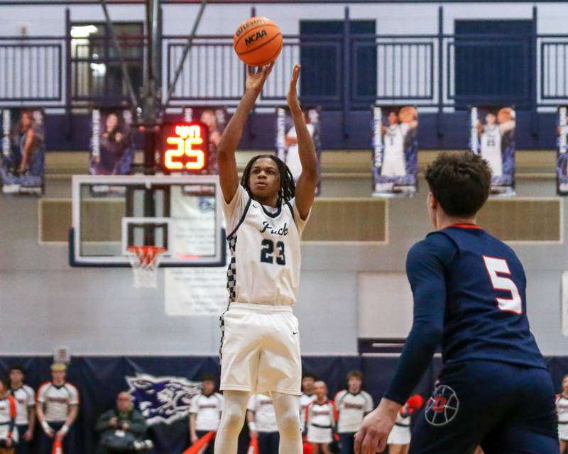 Oswego East's Mason Lockett (23) shoots a jump shot during their basketball game between Oswego at Oswego East, Feb 13, 2026 in Oswego.