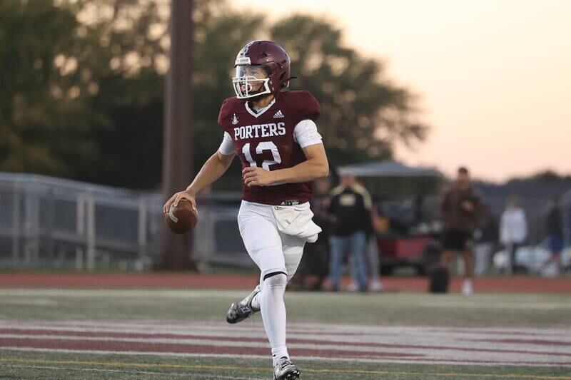 Lockport’s Brendan Mecher rolls out to pass against Lincoln-Way West on Friday, Oct. 18, 2024 in Lockport.