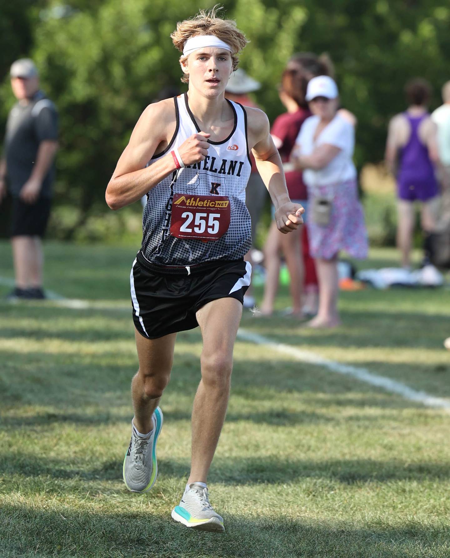Kaneland’s Evan Nosek runs to the finish during the Sycamore Cross Country Invitational Tuesday, Aug. 29, 2023, at Kishwaukee College in Malta.