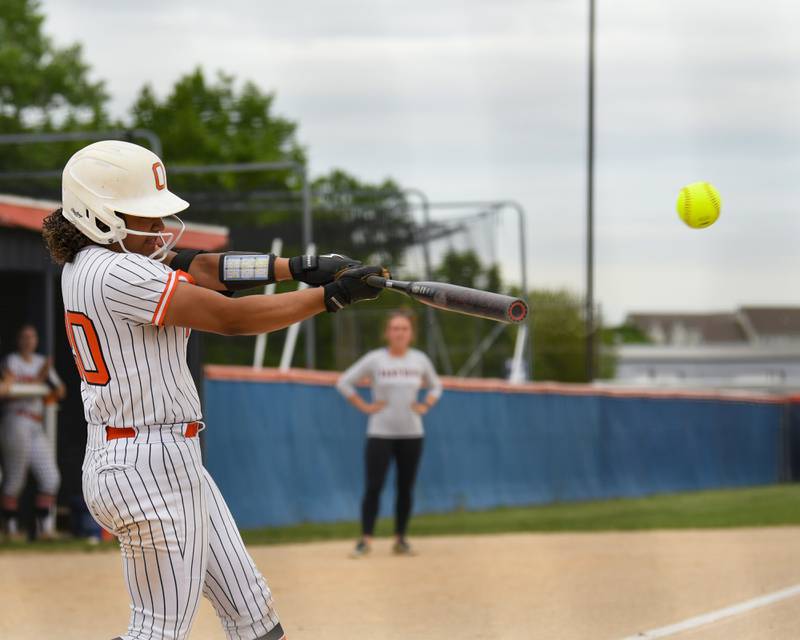 Oswego's Jaelynn Anthony (20) makes contact with the ball for a base hit the regional final game on Friday May 22, 2026, while taking on Benet Academy held at Oswego High School.