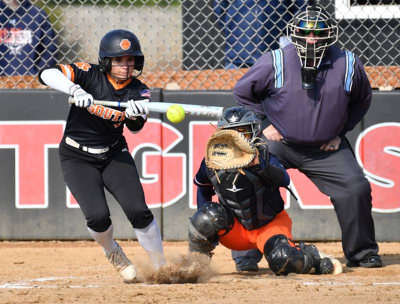 Wheaton Warrenville South’s Abby Mease lays down a bunt during a game against Oswego on April 10, 2025 at Wheaton Warrenville South High School in Wheaton.
