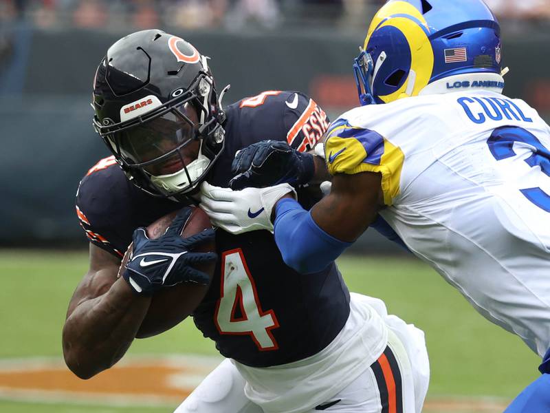 Chicago Bears running back D'Andre Swift tries to go through Los Angeles Rams safety Kamren Curl during their game Sunday, Sept. 29, 2024, at Soldier Field in Chicago.