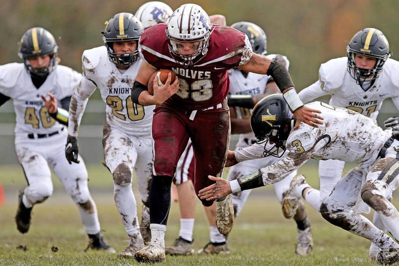 Prairie Ridge's Carter Evans runs the ball through the Grayslake North defense Saturday during their Class 6A first-round playoff game in Crystal Lake.