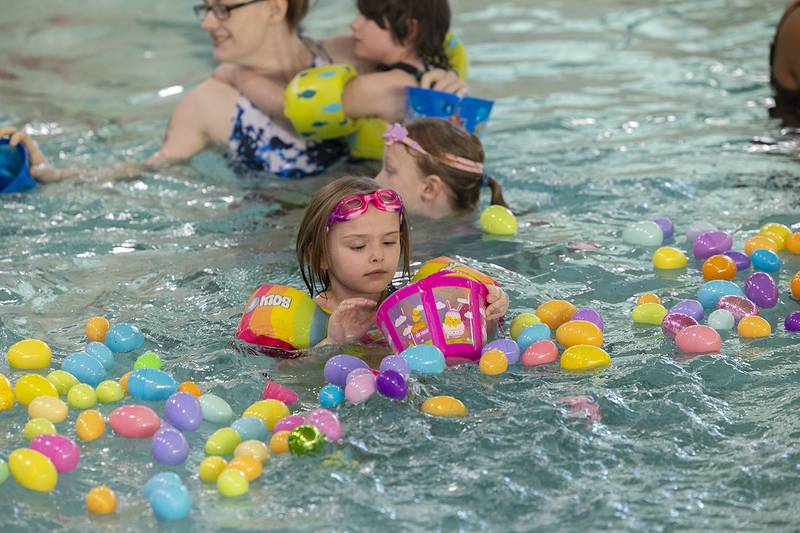 Elizabeth Everly, 5, of Sterling checks her basket Friday, April 11, 2025, during the Sterling-Rock Falls YMCA Easter Egg Hunt.