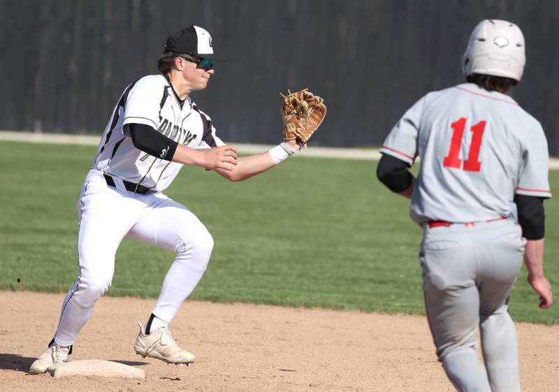 Sycamore's Nathan Lojko forces out Ottawa's Adam Swanson to start a double play during their game Friday, April 19, 2024, at the Sycamore Community Sports Complex.