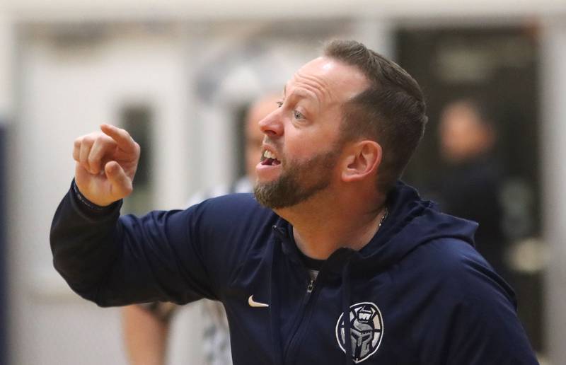 Cary-Grove’s Head Coach Adam McCloud guides the Trojans against Crystal Lake South in varsity boys basketball on Wednesday, Dec. 3, 2025, at Cary-Grove High School in Cary.