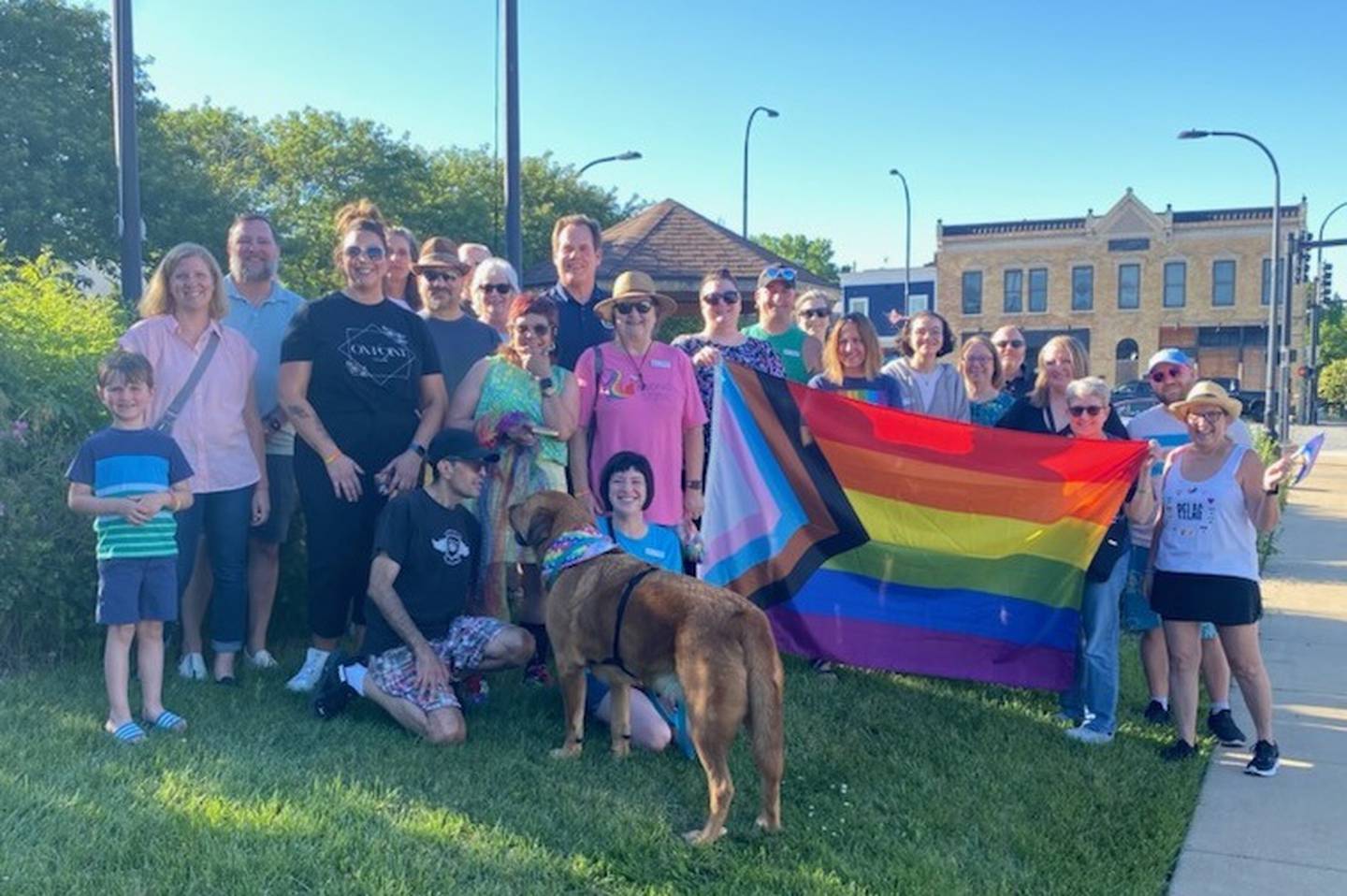 Geneva Mayor Kevin Burns (center left) stands with a crowd of supporters June 5 for the raising of the Pride Flag, in accordance with declaring June as Pride Month in Geneva.
