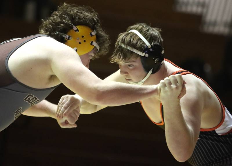 Jacobs’ Lucas Retzler, left, battles Crystal Lake Central’s Tommy McNeil at 215 pounds in varsity wrestling on Thursday, Jan. 16, 2025, at Jacobs High School in Algonquin.