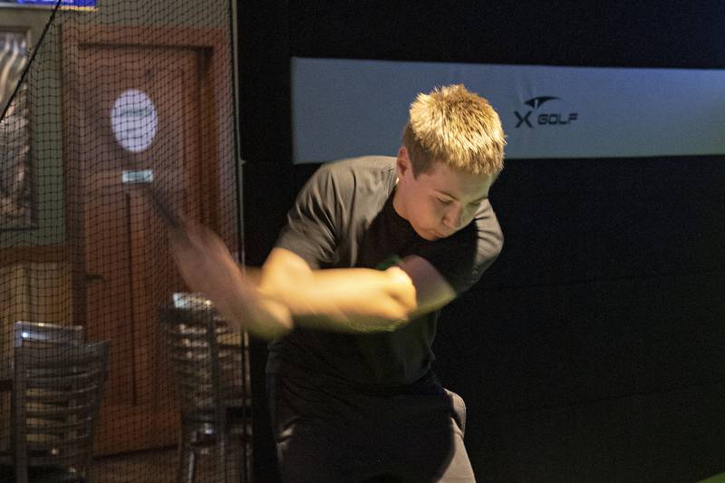 Cullen Cox of Rock Falls swings Thursday, August 7, 2025, at X-Golf Sauk Valley.