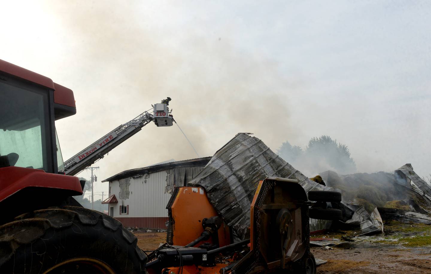 Firefighters from several departments were called to the scene of a shed fire at the intersection of Illinois Route 2 and Lost Nation Road, north of Dixon on Friday morning. Farm machinery and 120-150 round bales of hay were destroyed in the fire which was reported at 6:39 a.m.