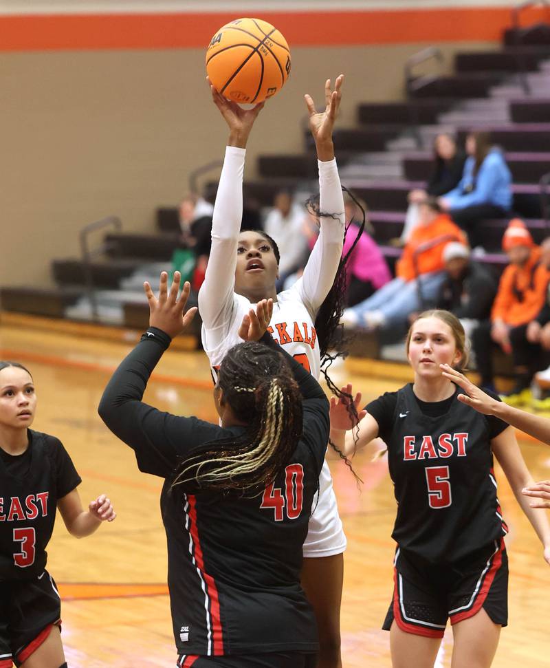 DeKalb's Brytasia  Long shoots over Rockford East's Makya Knox during their game Wednesday, Jan. 22, 2025, at DeKalb High School.