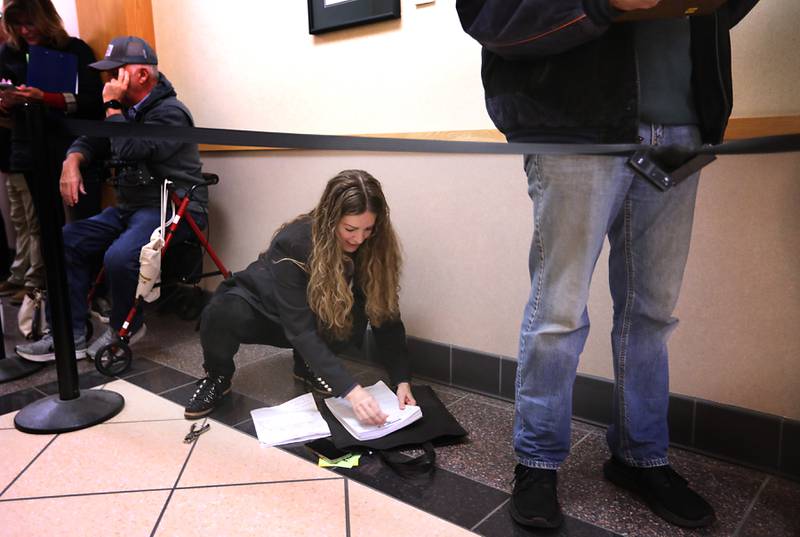 Diana Hartmann, the McHenry County Regional superintendent of schools, gets her candidacy paperwork in order while in line at the McHenry County clerk's office in Woodstock on Monday, Oct. 27, 2025, the first day of filing for 2026 spring primary election. Hartmann is seeking reelection.