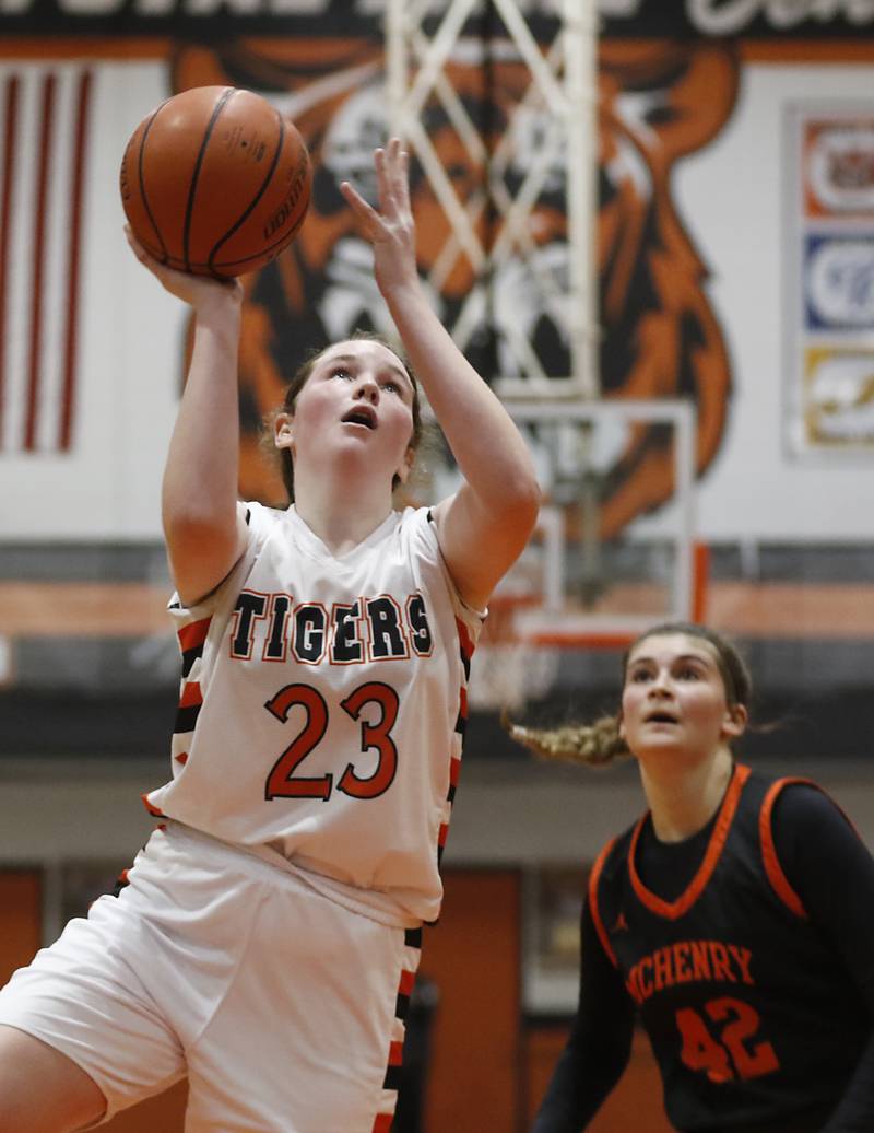 Crystal Lake Central's Leah Spychala drives to the basket against McHenry's Madalynn Friedle during a Fox Valley Conference girls basketball game Tuesday, Nov.. 29, 2022, between Crystal Lake Central and McHenry at Crystal Lake Central High School.