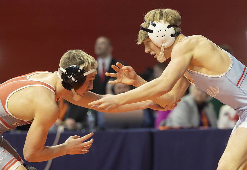 Vandalia’s Preston Waughtel (left) and Marian Central’s Brayden Teunissen compete in the 120 pound weight class of the 1A state individual wrestling finals Saturday, Feb. 22, 2025, at State Farm Center in Champaign.