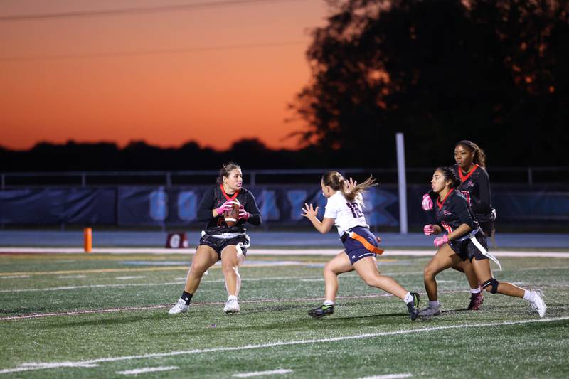 Yorkville's Kayla Kersting looks to pass as Oswego's Cynara Jackson closes in during the Foxes' 2-1 overtime victory over Oswego in the IHSA Kankakee Regional championship game on Thursday, Oct. 9, 2025.