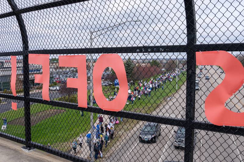 Protesters hold up protest signs along Randall Road in South Elgin, IL to protest their issues with President Donald J. Trump and his administration and Elon Musk involvement in US government affairs on Saturday April 19, 2025. 
Hundreds of protesters participated in the latest Hands Off protest occurring in the Chicagoland area and the rest of the country.