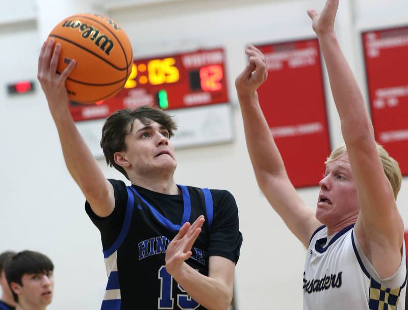 Hinckley-Big Rock's Gavin Pickert shoots over Marquette's Luke McCullough Tuesday, March 3, 2026, during their sectional semifinal matchup at Amboy High School.