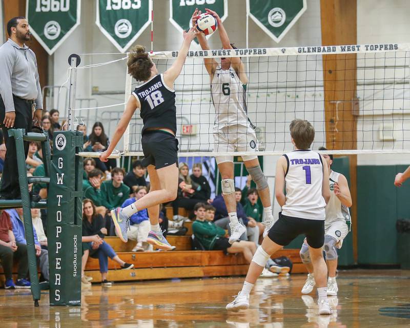 Glenbard West's Jack Anderson (6) blocks a shot during volleyball match between Downers Grove North at Glenbard West.  April 2, 2024.