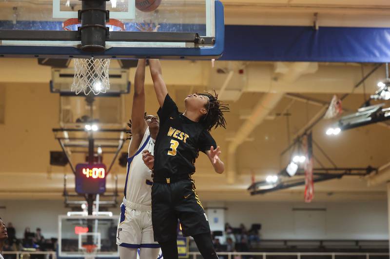 Joliet West’s Tristan Sanders lays in a shot against Joliet Central on Saturday, Jan. 27th, 2024 in Joliet.